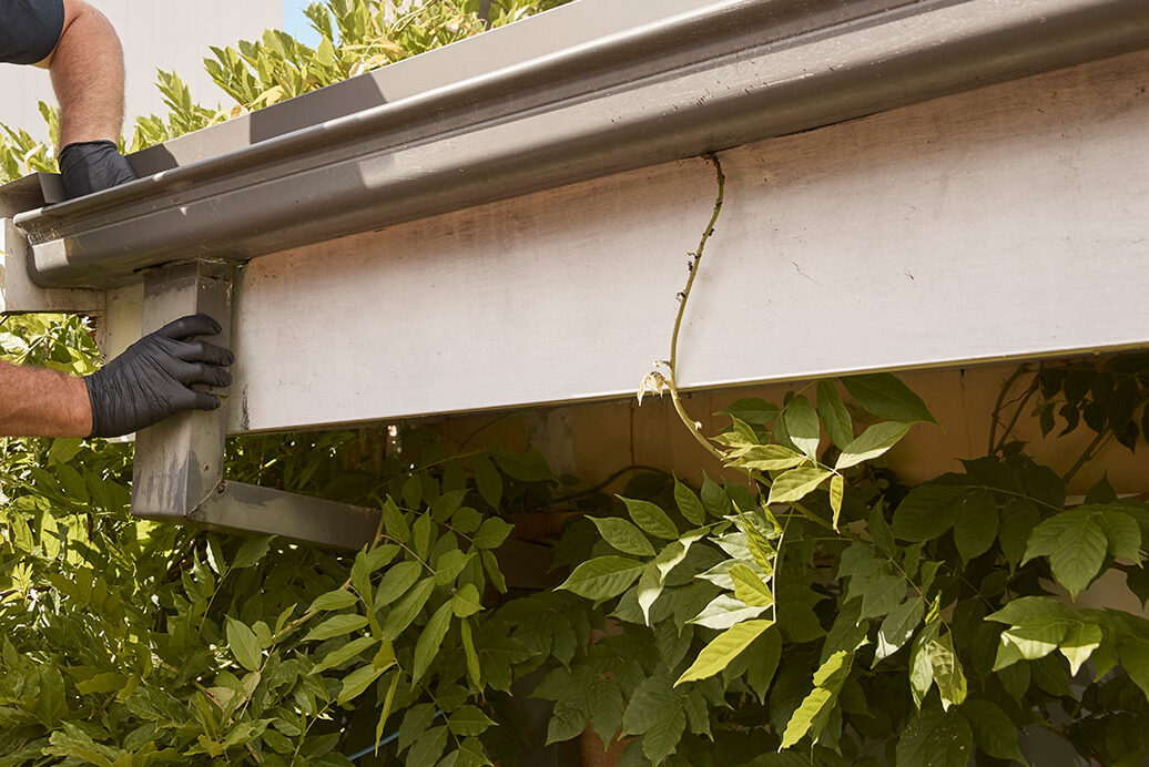 plumber fixing roof plumbing